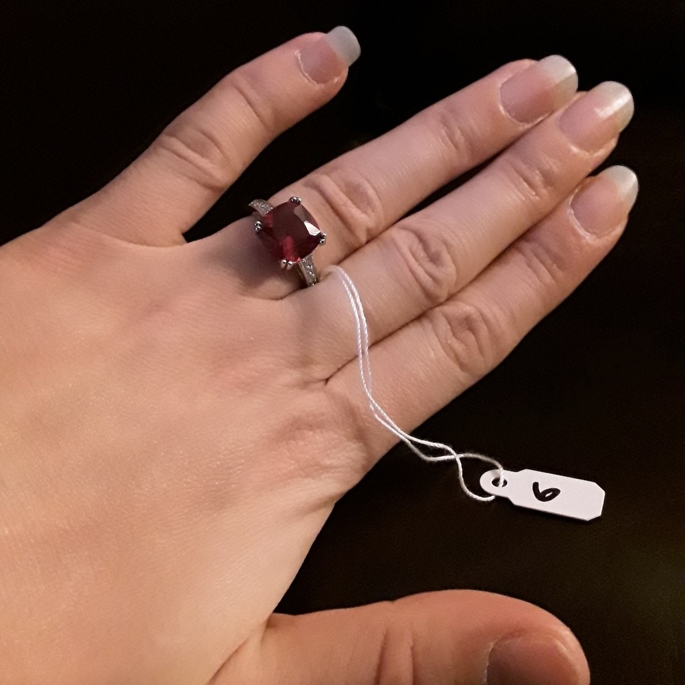 Engagement ring with red color crystal
